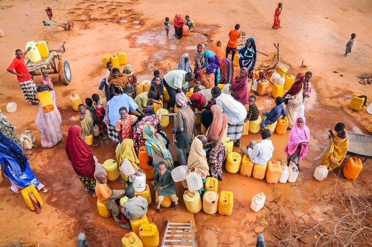 Community members collecting water during drought response